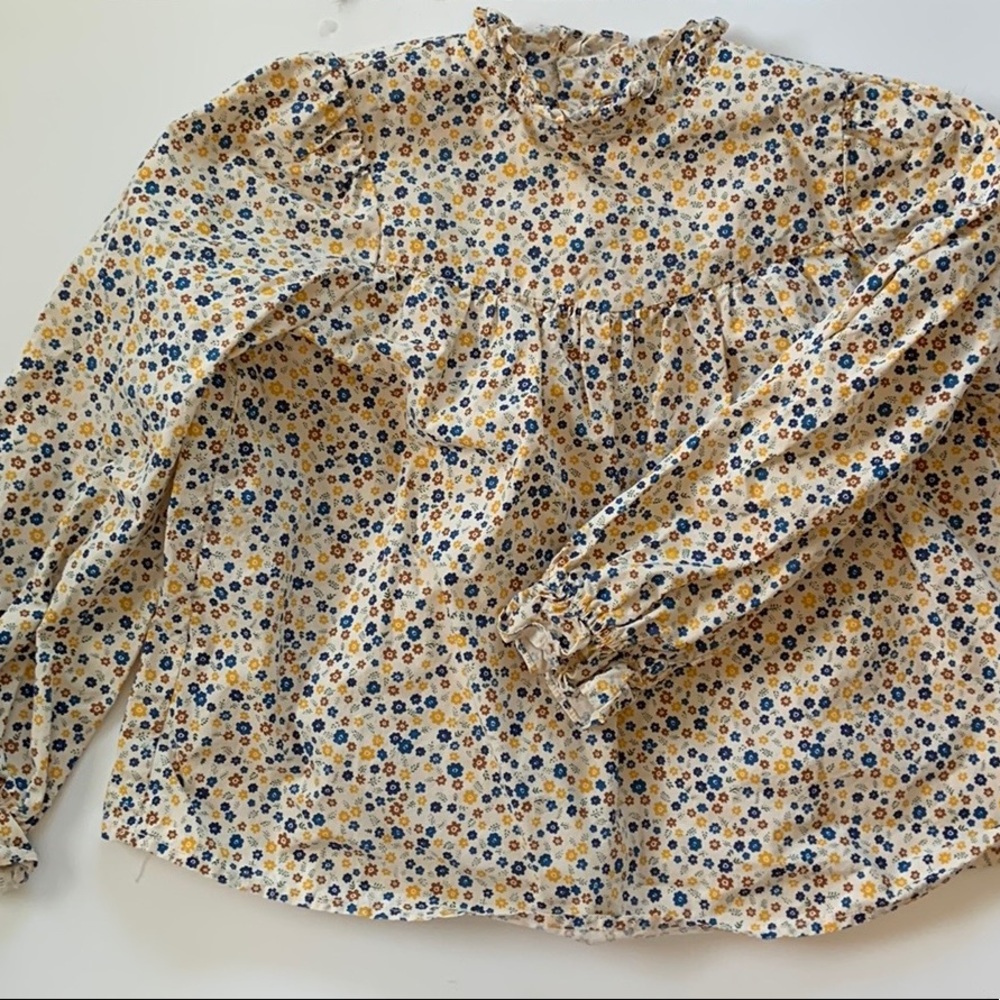 Two piece flowered skirt and shirt.